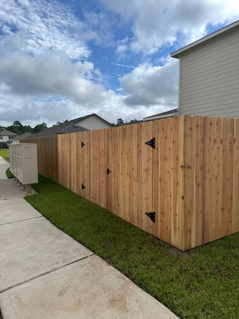 Finished cedar fence extension with double gate