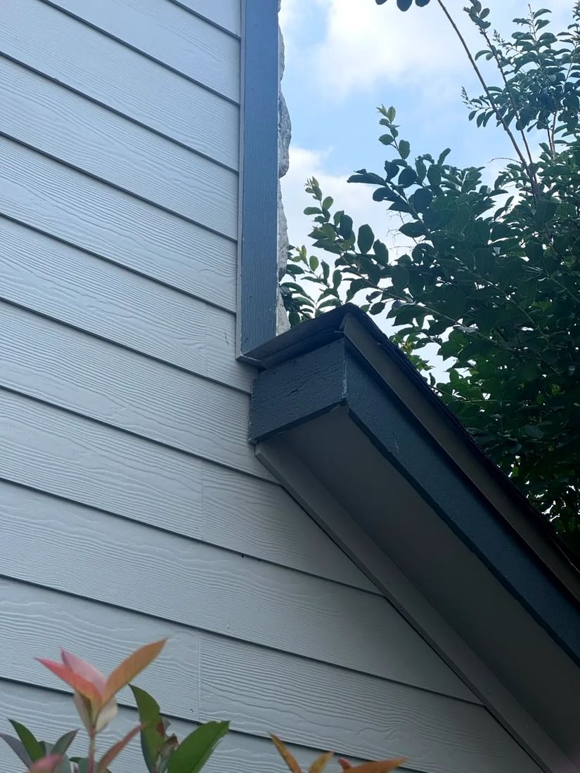 Finished siding and paint detail after replacement