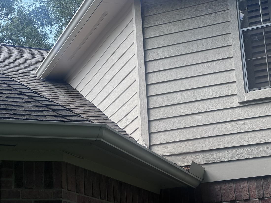Repaired and repainted siding after storm damage repair in The Woodlands, TX